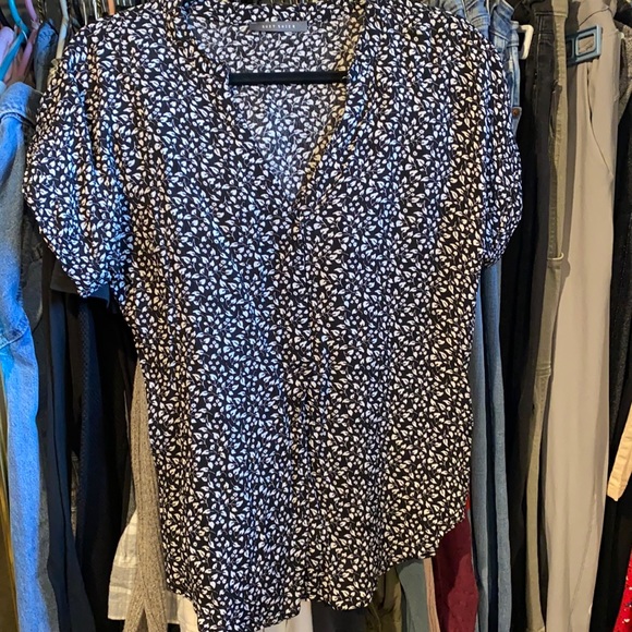 Never worn, size small, in good condition, black and white, short sleeve. - Picture 1 of 3